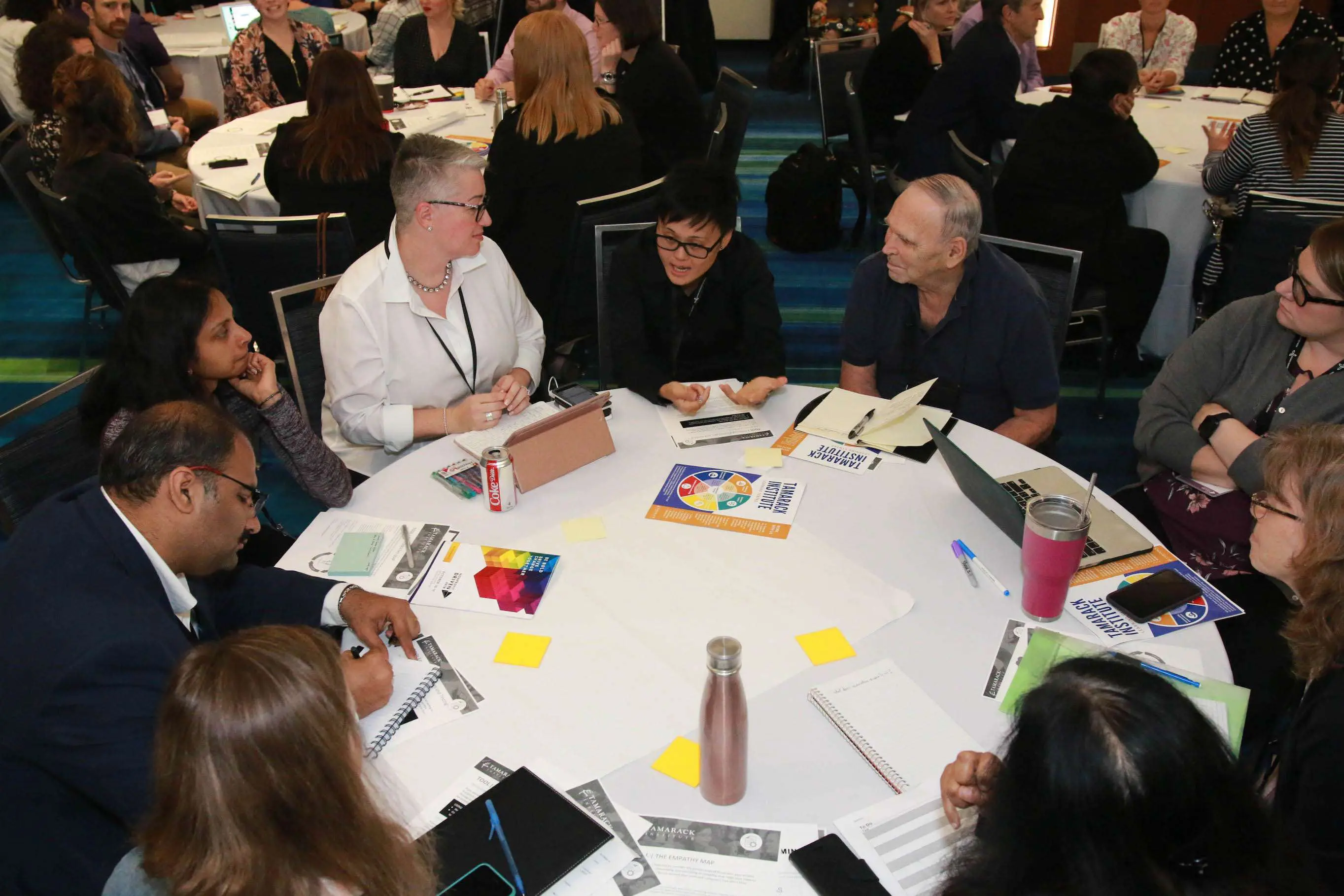 People at a workshop collaborating around a table
